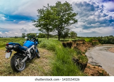 Armavir, Krasnodarsky Kray / Russia -  May 26 2019: Yamaha Motorcycle Stands On A Cliff On The Background Of A Mountain River And Clouds.