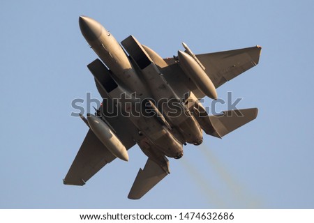 Armed fighter jet in flight