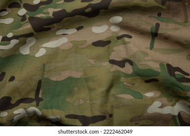 Armed force multicam camouflage fabric texture background.