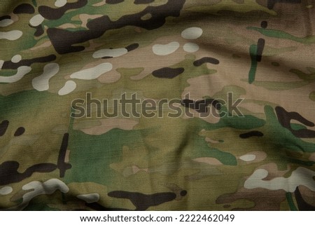 Armed force multicam camouflage fabric texture background.