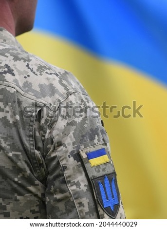 Armed Forces of Ukraine. Ukrainian soldier. Ukrainian in army. Ukrainian flag on military uniform. 