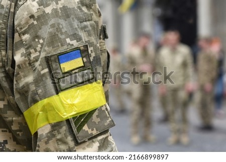 Armed Forces of Ukraine. Ukrainian soldier. Ukrainian army. Ukrainian flag on military uniform. 