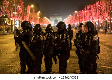 Armed Police Force In Front Of Arc De Triomphe In The Night During The 