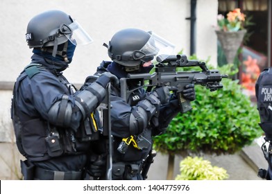 Armed Police Keep Guard At A Security Situation.