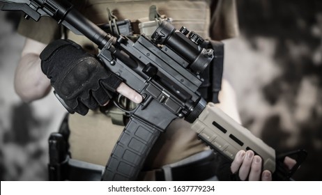 Armed Security Contractor Holding An AR15 Rifle.