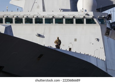 An Armed Soldier Aboard A Large Army Warship. Security Of Military Ships. Riga, Latvia - 30 Oct 2022.