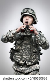 Armed Soldier Holding A Binoculars.