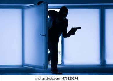 Armed Thief Entering A House