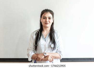 Armenian Female Doctor With Stethoscope In Uniform. Health Care And Medical Concept In Armenian.