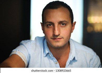 Armenian Handsome Man Portrait Smoking Hookah In Cafe
