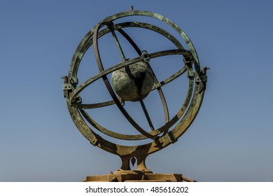 Armillary sphere on a blue background in Bayona, Spain