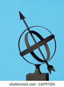 Armillary Sphere silhouetted against a blue background