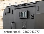 Armored vehicle car truck back door detail, jail prison van, money valuables transport prisoner transportation special operations heavily armored military vehicles simple conceptual symbol closed door