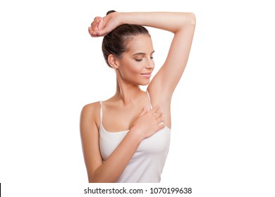 Armpit Epilation, Lacer Hair Removal. Beauty Young Woman Holding Her Arms Up And Showing Clean Underarms, Depilation Smooth Clear Skin. Beauty Portrait. Beautiful Brunette Girl After Removal Hair.  