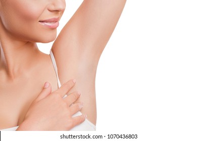Armpit epilation, lacer hair removal. Beauty Young Woman holding her arms up and showing clean underarms, depilation smooth  clear skin. Beauty  portrait. Beautiful Girl after removal hair  under her 