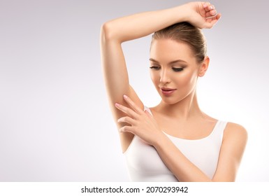 Armpit Epilation, Lacer Hair Removal. Young Woman Holding Her Arms Up And Showing Clean Underarms, Depilation  Smooth Clear Skin .Beauty Portrait.