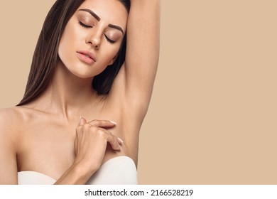 Armpit epilation, lacer hair removal. Young woman holding her arms up and showing clean underarms, depilation smooth clear skin .Beauty portrait