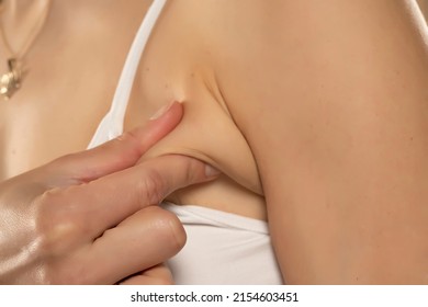 Armpit fat at woman between 30-40 years old dressed in a sporty bra. closeup photo. - Shutterstock ID 2154603451