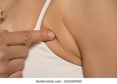 Armpit Fat At Woman Between 30-40 Years Old Dressed In A Sporty Bra. Closeup Photo