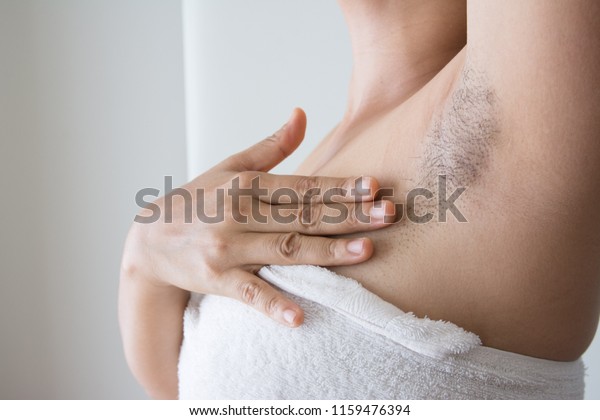 Armpit\
and armpit hair of Asian women on white\
background