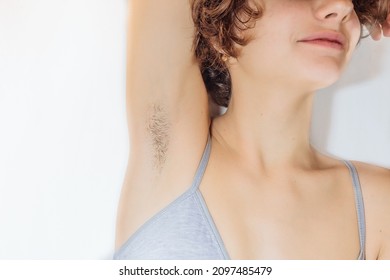 Armpit hair on a young teenager. Close-up shot of underarm hair on young body of Caucasian girl. hairy armpits teen