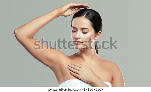Armpit woman\
hand up clean skin depilation\
concept