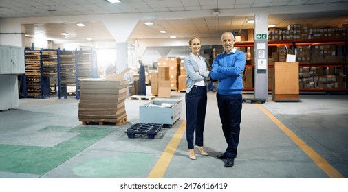 Arms crossed, collaboration and warehouse with portrait of business people together for delivery management. Logistics, shipping or supply chain with man and woman employee in factory or plant - Powered by Shutterstock