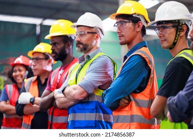 Arms crossed. Professional team working at workplace. Unity and teamwork concept. Portrait engineer factory manager worker and mechanic team together in factory workplace - Shutterstock ID 2174856387