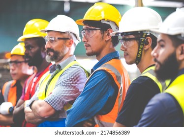 Arms crossed. Professional team working at workplace. Unity and teamwork concept. Portrait engineer factory manager worker and mechanic team together in factory workplace - Shutterstock ID 2174856389