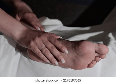 Arms And Legs On A White Cloth. Human Toes And Foot. Relationships Of People. Woman In Bed.