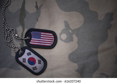 Army Blank, Dog Tag With Flag Of United States Of America And South Korea On The Khaki Texture Background. Military Concept