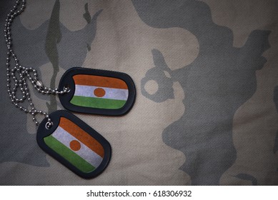 Army Blank, Dog Tag With Flag Of Niger On The Khaki Texture Background. Military Concept