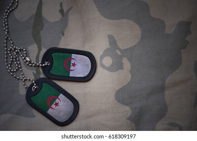 Army Blank, Dog Tag With Flag Of Algeria On The Khaki Texture Background. Military Concept