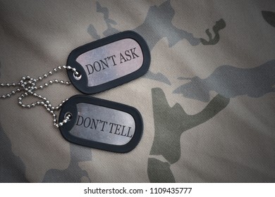 Army Blank, Dog Tag With Text Dont Ask Dont Tell On The Khaki Texture Background. Military Concept