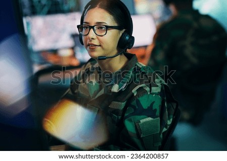 Army command center, computer and woman in headset, global surveillance and tech for communication. Security, intelligence and soldier at desk in military office at government cyber data control room