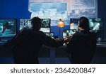 Army control room, computer and team in surveillance, help and collaboration in tech communication from back. Security, satellite map and man with woman at monitor in military office command center.