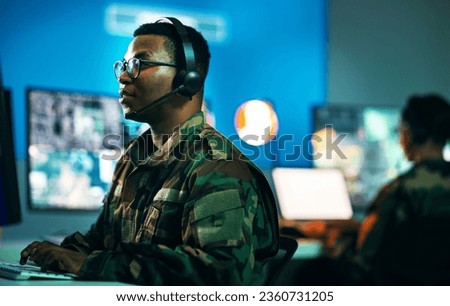 Army, control room and man on computer in office, data center and monitor for technical support, cybersecurity or surveillance. Military, officer or work in tech, security or government communication
