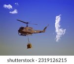Army helicopter huey lift cargo  