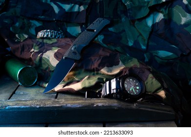 Army knife and military watch. Anti-shock knives and a sharp knife. Knife and watch set. Military set. - Shutterstock ID 2213633093