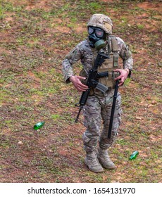 Army Officer Wearing Tear Gas Mask And Have Machine Gun