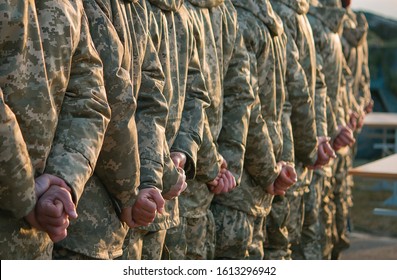 Army Parade, Military Force Uniform Soldier Row March. Selective Focus On Hands.