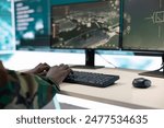 Army IT professional targeting enemy vessels on a gps satellite station world map, operating from command center monitoring room. General studies surveillance CCTV live transmission. Close up.