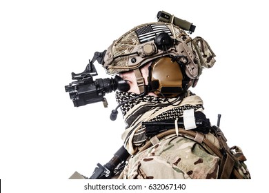 Army Ranger in field Uniforms with weapon, plate carrier and combat helmet are on, his face closed by Shemagh Kufiya scarf. Studio shot