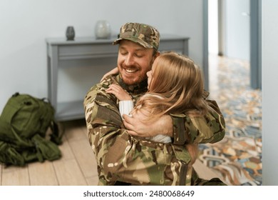 Army soldier embracing his daughter after coming back home. Happy serviceman surprising his kid with his return. Military man reuniting with his family after deployment  - Powered by Shutterstock