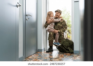 Army soldier embracing his daughter after coming back home. Happy serviceman surprising his kid with his return. Military man reuniting with his family after deployment  - Powered by Shutterstock