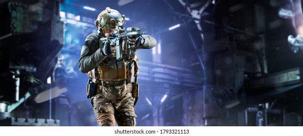 Army Soldier In Protective Combat Uniform Holding Special Operations Forces Combat Assault Rifle On Dark Background