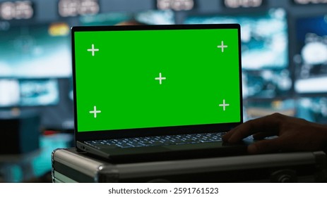Army telecommunication systems operator using green screen gear, providing combat support. Military dispatcher managing communications networks with mockup laptop, camera A
