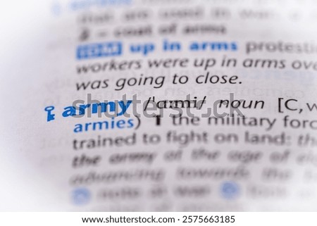 Army word in a dictionary. Selective focus, close up.