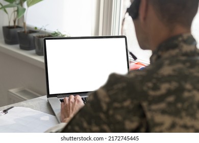 Army. Young Soldier Working With A Laptop Computer With Blank Screen On Black Background.