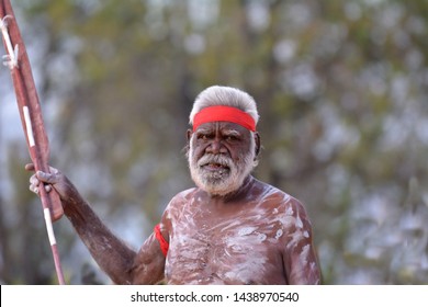 ARNHEM LAND, NT - JUNE 08 2019:Indigenous Australians Aboriginal Man Holding Weapones, Dancing A Cultural Ceremony Dance.